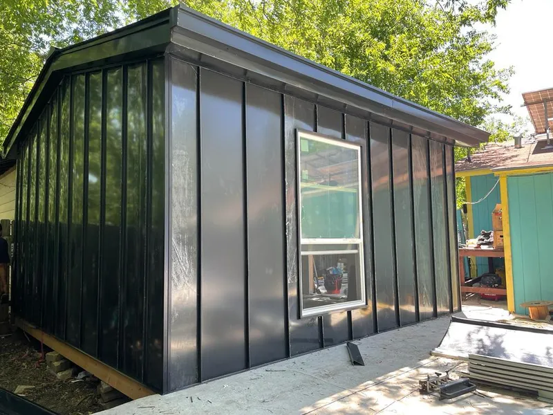 Black standing seam metal wall panels for Metal Roof Installation in Dryden