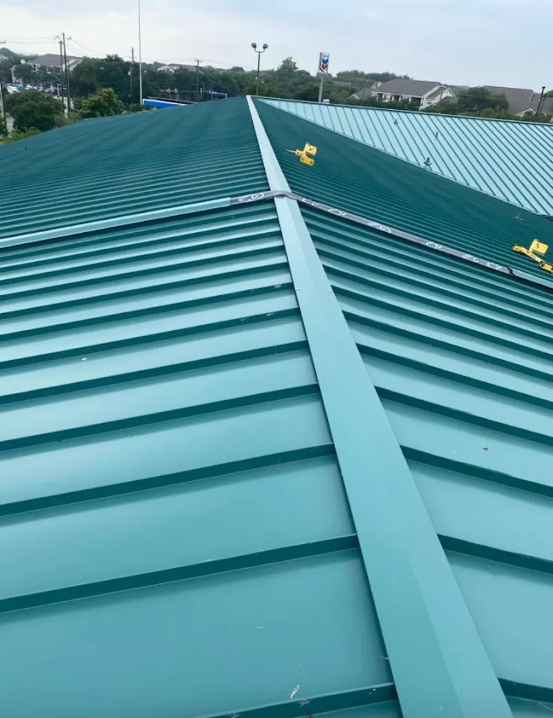 Green commercial metal roof ridge and valley for Metal Roof Repair in Dryden